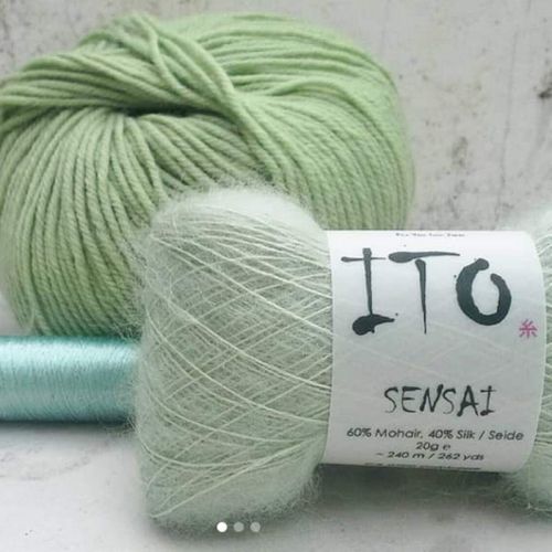 3 verschiedene Strickgarne in blassem Grün